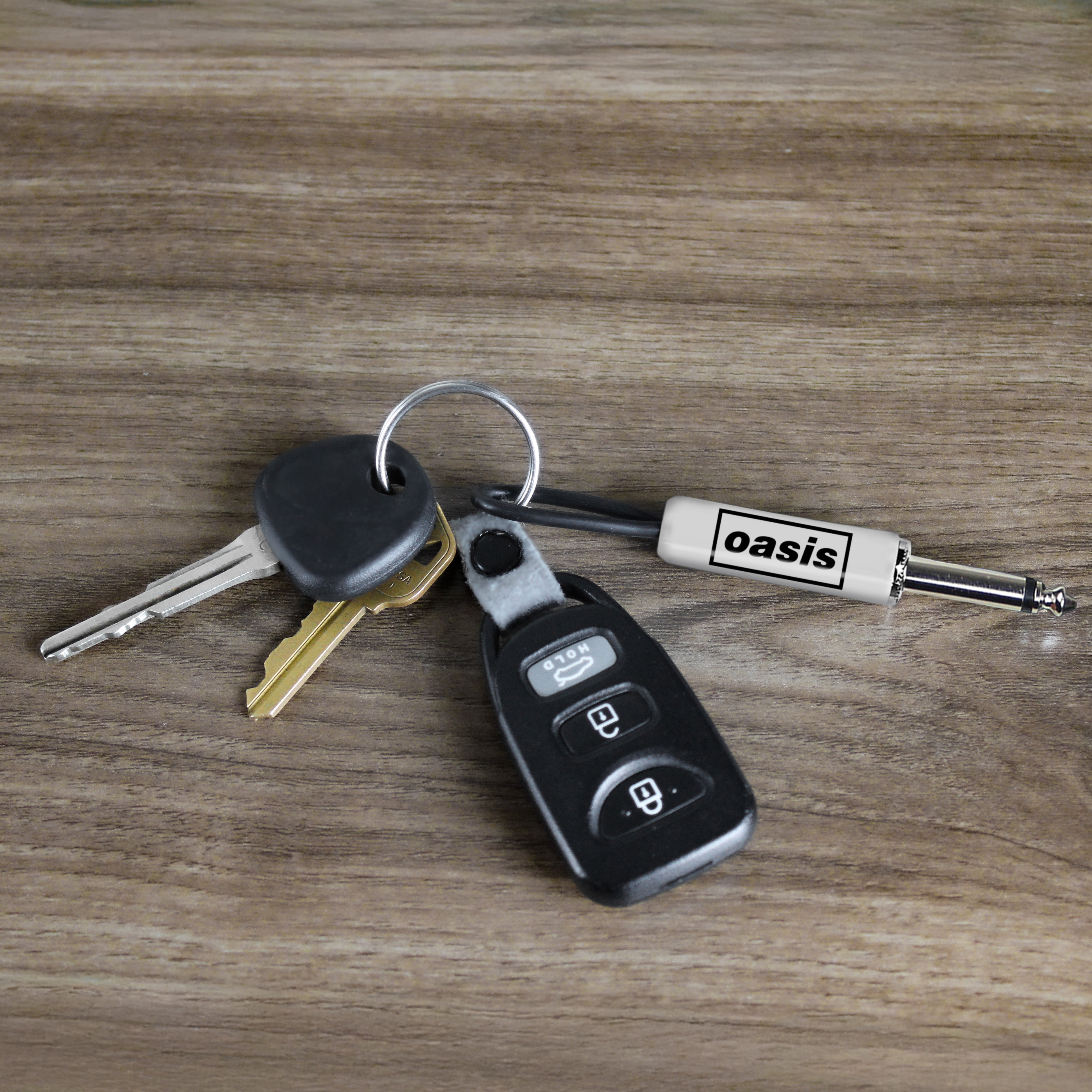 OASIS LOGO GUITAR PLUG KEYCHAIN